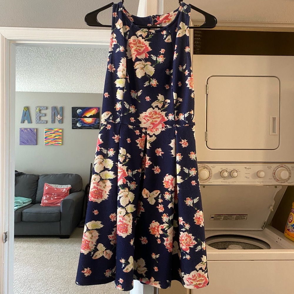 Navy blue dress with open back design and flowers